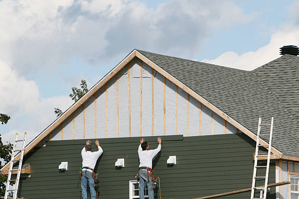 Professional Storm Damage Siding Repair technician working in Gambier, OH